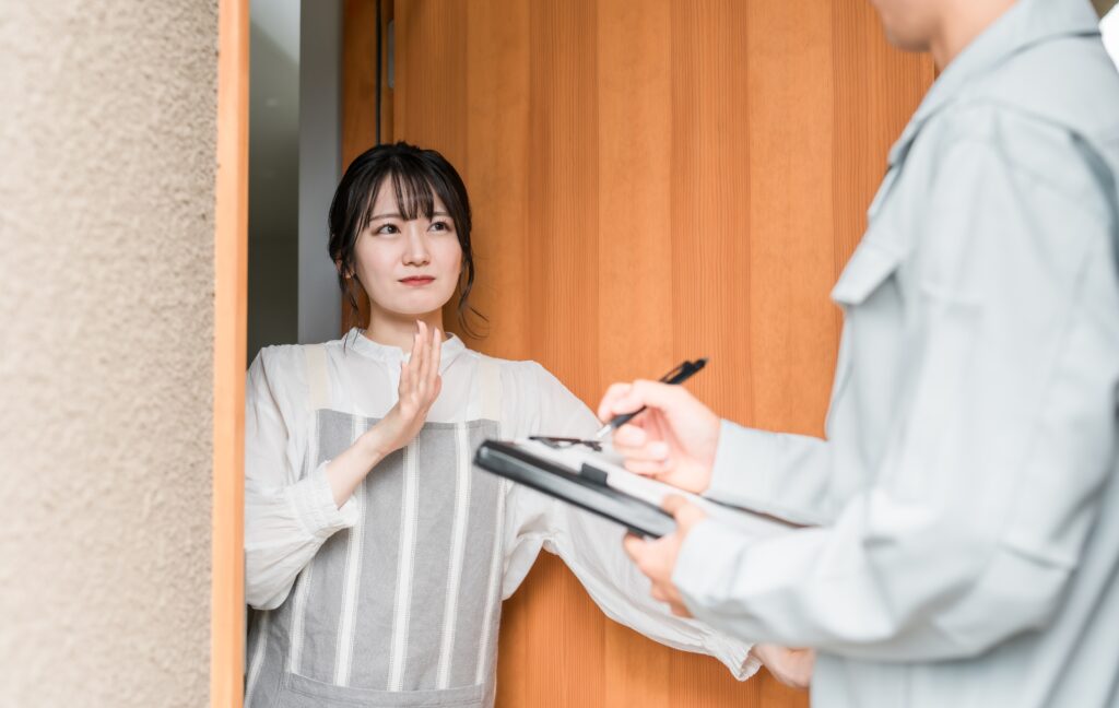 Female customer rejecting a face-to-face marketing representative.