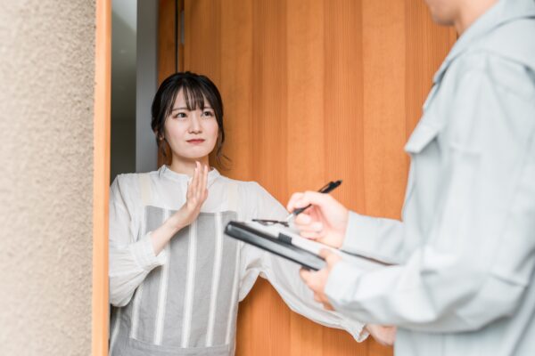 Female customer rejecting a face-to-face marketing representative.