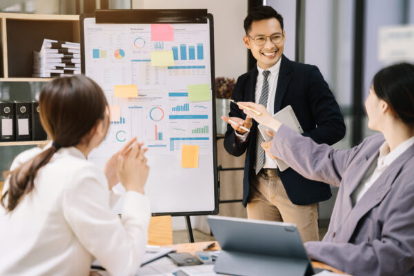 A sales team discussing sales strategies together.